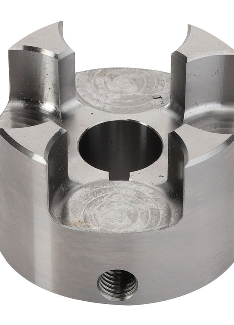 The AGCO | CLUTCH - D28730181 is a metallic cylindrical component featuring a central hole and four symmetrical slots, designed for mechanical purposes. Detailed product description information is currently unavailable.