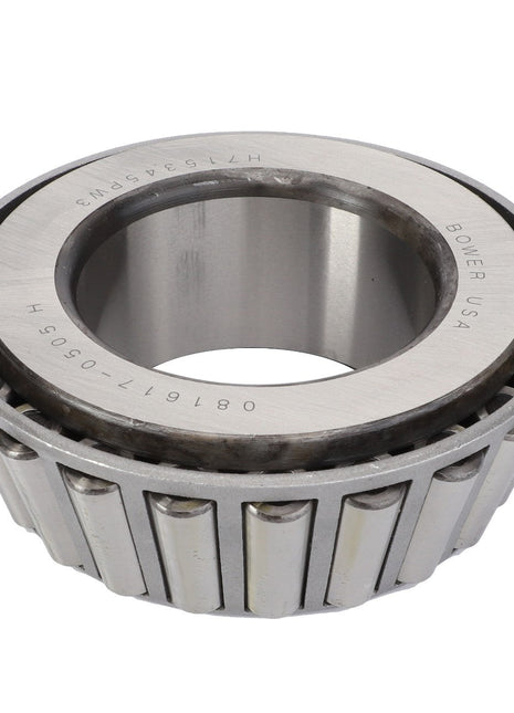 A single AGCO tapered roller bearing (CH2D-9455) with metal rollers enclosed in a ring. The inner cone is marked with text including "BOWER USA" and numeric codes.