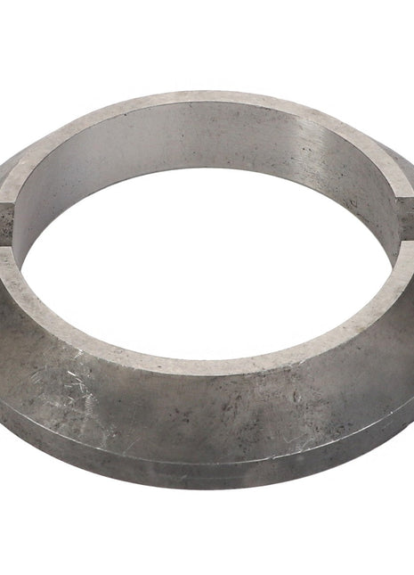 The AGCO SLEEVE BUSHING - V30385700 is a metallic, ring-shaped object with a flat surface and a circular opening.