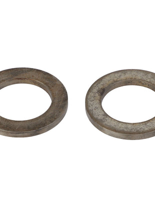 Two AGCO SPACER - AG708918 metal washers, each featuring a circular shape with a central hole, placed side by side on a white background. No current product description information is available.