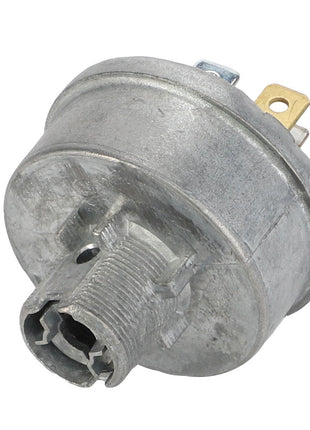 The AGCO | SWITCH - CG1184500651 is a metal cylindrical electrical component that features connectors and a threaded section at the bottom. Additional product description information is currently not available.