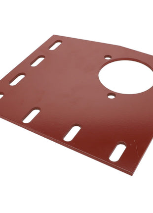 The AGCO BEARING PLATE - D28880284 is a red metal plate featuring a large circular hole and multiple elongated slots arranged in a row.