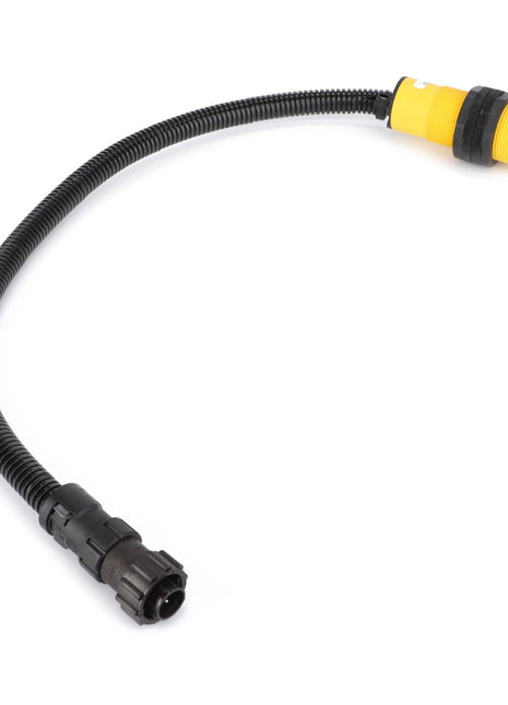 Coiled black cable with connectors on both ends, featuring a distinctive yellow terminal on one end; AGCO | WARN INDICATOR - D28780531 by AGCO.