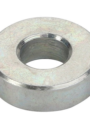 The AGCO | Spacer - Acx2508430 is a sturdy metallic flat washer with a central hole, designed to distribute the load of a threaded fastener effectively.