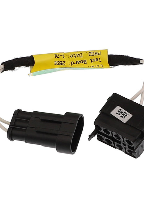 Two black electrical connectors with attached wires and a yellow label containing the product information for AGCO | Harness - Acw0600280. However, no current product description information is available.