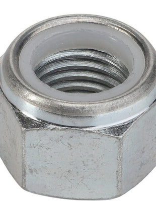 A close-up of the AGCO | Nut - Acp0497950, a metal hex nut with internal threading and a nylon insert, commonly known as a nyloc nut.