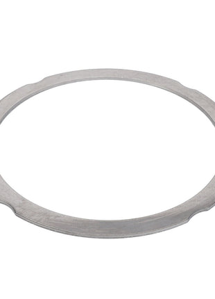 A flat, circular metal gasket known as the AGCO Compensating Ring (F390200210140) from the AGCO brand features a smooth surface and three slight indentations equally spaced around its outer edge. No Current Product Description Available.