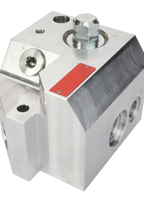 A polished metallic mechanical component block with multiple holes and a red rectangular label: AGCO | Valve - Acp0667830 by AGCO.