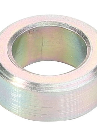 The AGCO Spacer - Acw0803700, a metal spacer ring with a smooth, cylindrical outer surface and a hollow center, shown against a plain background. No current product description information is available.
