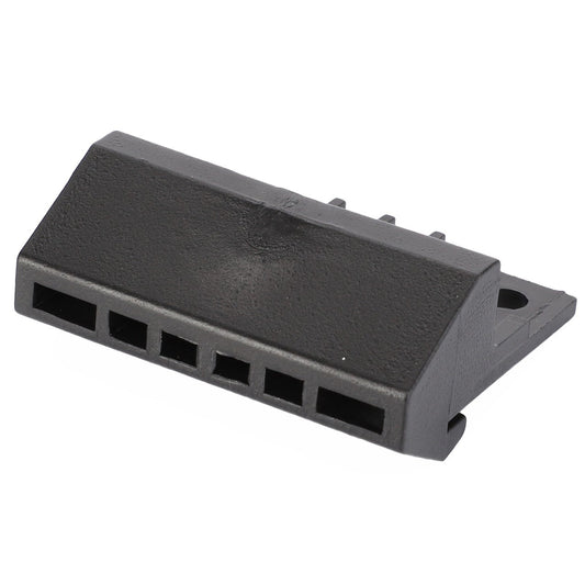 The AGCO | Tensioning Piece - 117501021080 is a black plastic electrical connector that features multiple slots, an angled design, and a mounting hole, making it perfect for Vario and FAVORIT Fendt models.