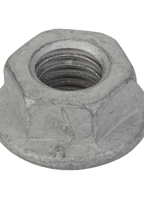 Close-up image of the AGCO Hex Nut - Acp0676630, featuring a flanged base and crafted from metal. The threading is clearly visible inside the central hole. No current product description available.