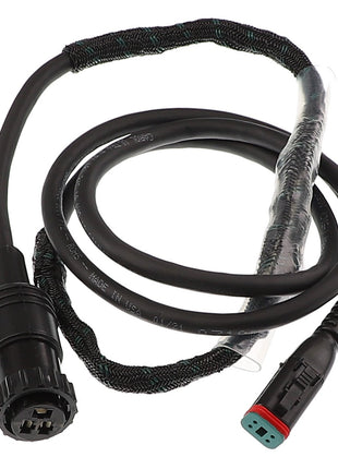 The AGCO | Cab Harness - Acw4918670 by AGCO is a black cable featuring a circular connector on one end and a rectangular connector on the other, partially wrapped in a protective braided sleeve. Further specifications are currently unavailable.