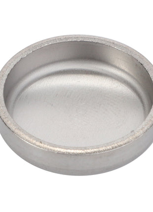 An AGCO | Freeze Plug - F824200210990, a round, shallow metallic container with smooth edges and a flat bottom, currently has no product description information available.