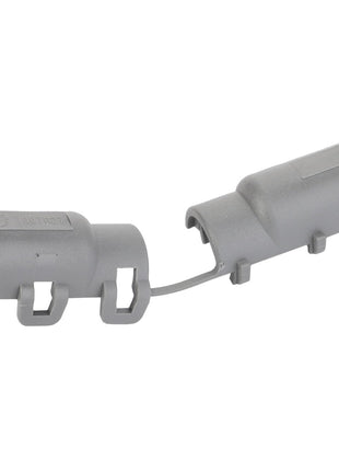 The AGCO Adapter - F530200050710 is a gray plastic molded dual-ended component with a flexible connecting strip and customizable attachment features on both ends.