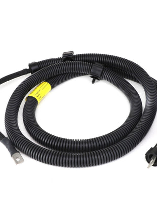 The AGCO | Harness - Acw032959A, a black plastic automotive wiring harness neatly coiled and featuring connectors at both ends, is marked with a yellow label in the middle.