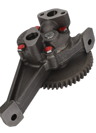 A close-up of a metal automotive part, featuring a gear and several mounting points. Product: AGCO Lubricating Oil Pump - Acw1838790, Brand: AGCO.