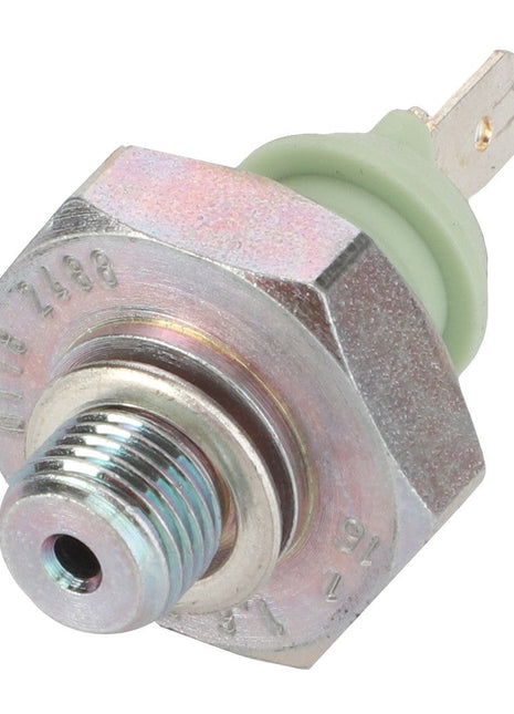 Close-up of an AGCO Oil Pressure Sensor - F007201510042, featuring metal and plastic components with threaded and flat connectors, likely used for monitoring oil pressure in a vehicle system. No product description available.