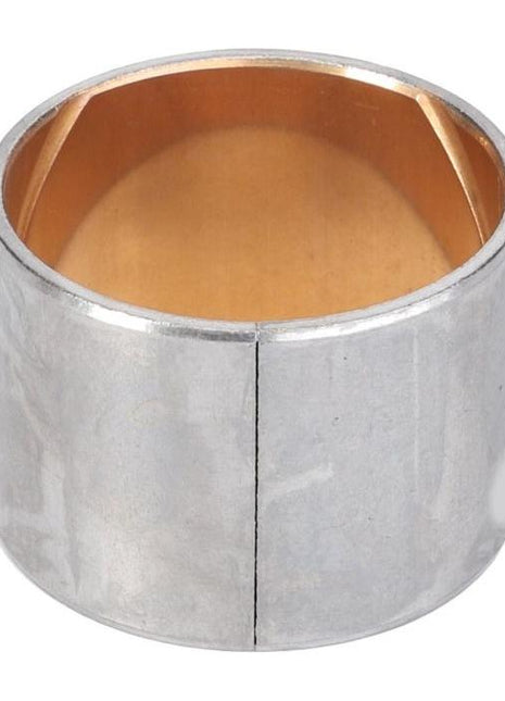 A silver metallic bushing with a split along its side and a bronze interior, designed as a replacement part for various Massey Ferguson models. This product, VA125390, is manufactured by AGCO.