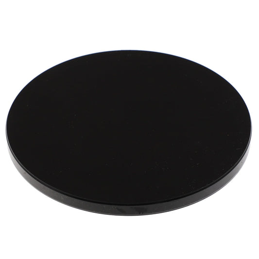 A sleek, black AGCO Cap - Acp0557640 with a smooth surface lies against a stark white background, presenting a striking contrast.