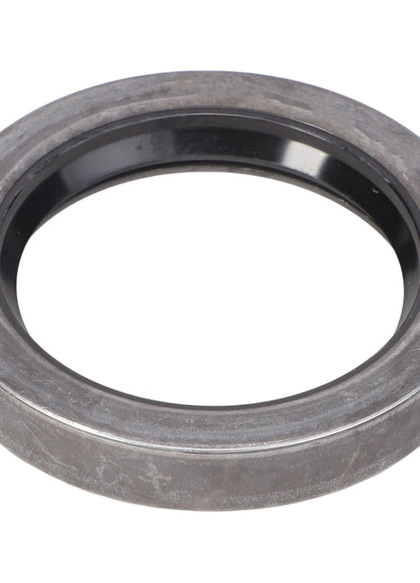 The AGCO SEAL - E1443 is a round, gray metal ring with a black inner lining, often used as a mechanical seal or bearing in machinery.