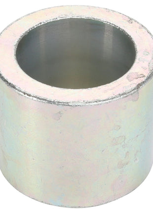 The AGCO Spacer - Acw1038030 features a metallic cylindrical sleeve with a hollow center, light-reflective surface, and slight wear marks on its exterior, subtly showcasing signs of use.