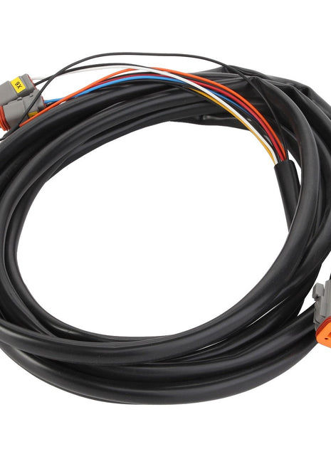 The AGCO | CABLE - AL60003889 by AGCO is a coiled electrical wire harness consisting of multiple colored wires, encased in sleek black sheathing, and expertly terminated with gray plastic connectors at each end.