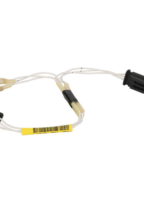 The AGCO Harness - Act0012410 by AGCO includes white wires and black connectors on each end, along with a labeled yellow bar code tag.