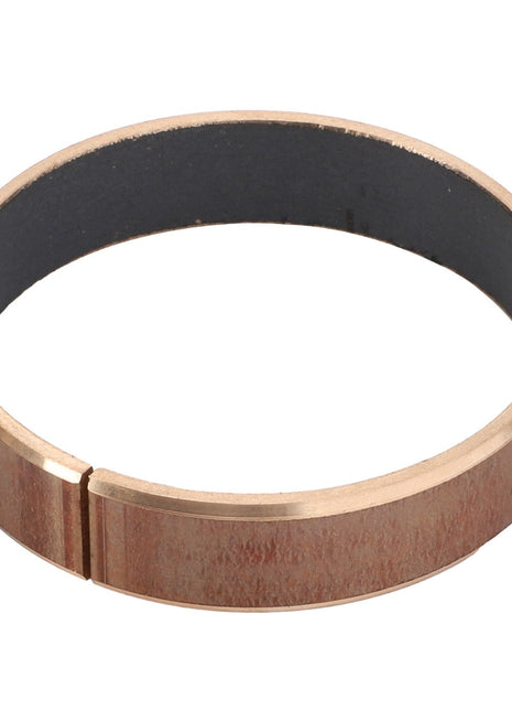 The AGCO | INSERT - D28286049 by AGCO is a minimalist round copper bracelet designed with a small gap and accented with a dark interior lining.