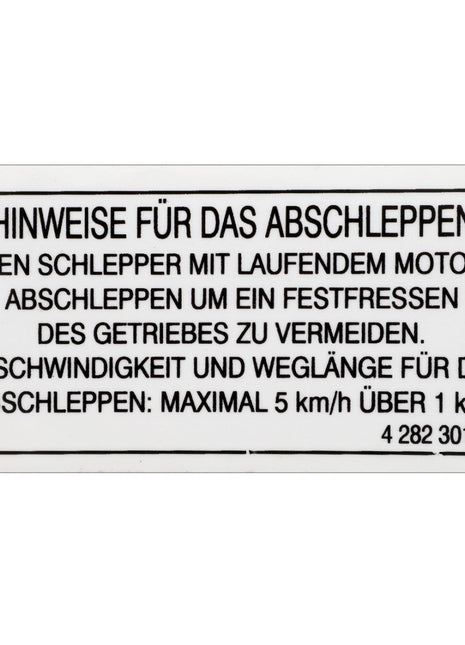 The AGCO | Decal - 4282301M1, a German sign from AGCO providing towing instructions, warns to keep the engine running to avoid gear seizure and specifies a towing speed limit of 5 km/h over a distance of up to 1 km. The decal features factory-engineered stickers for enhanced visibility and durability.