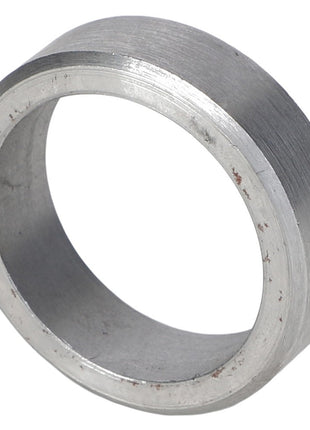 A close-up view of the AGCO Bush - Acp0012070 reveals a metallic bushing with a smooth surface, cylindrical shape, and encircled by a slight edge, ensuring precision. Brand: AGCO.