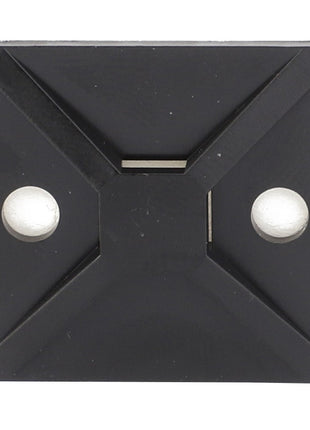 Close-up of the AGCO TIE PLATE - AG517942, a black, square-shaped cable tie mount with an adhesive back and two screw mounting holes. No current product description information is available.