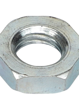 Close-up of the AGCO NUT - AL5011076, a hexagonal metal nut with an internal threaded hole, showcasing its precise engineering.