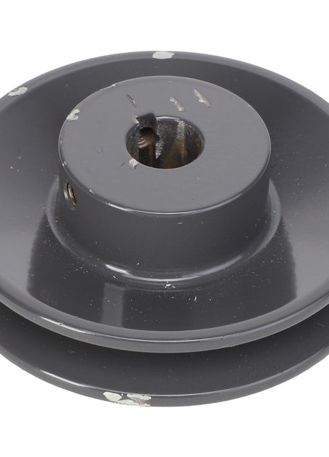 Close-up of the AGCO Sheave - Acx2767770, featuring a metallic build with a dark gray finish and minor surface wear. This sheave includes a central hole and two grooves around its circumference. Note: No current product description information is available.