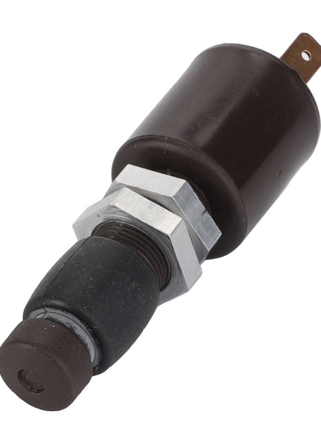 The AGCO | Switch - D26733124, a cylindrical black electrical component featuring a metal nut and rubber end, is photographed against a pristine white background.