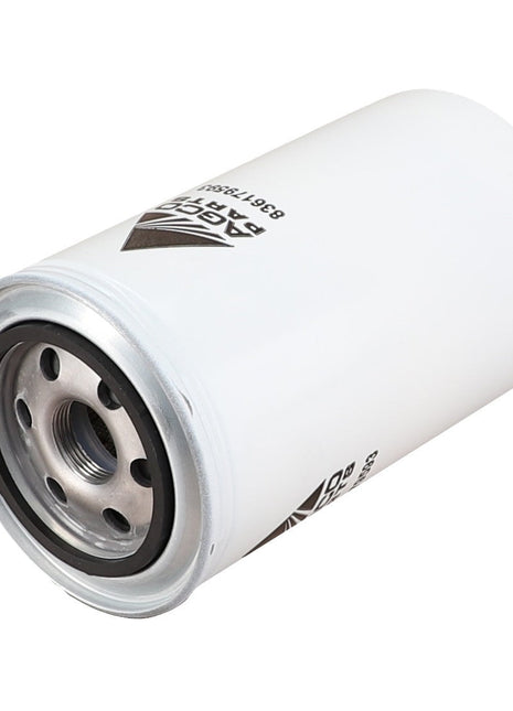 A cylindrical automotive engine oil filter with a white exterior, silver base, and multiple openings for oil flow, labeled "AGCO | Engine Oil Filter Spin On - V836179593". This filter extends component life by preventing wear and corrosion.