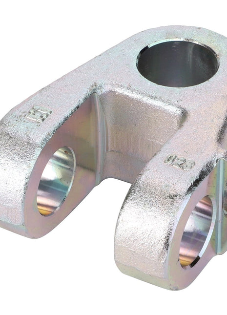 The AGCO | Accessory Code - Acw0634230 by AGCO is a metal clevis yoke featuring two circular holes and a central cylindrical opening, designed as a mechanical connector. No current product description information is available at this time.