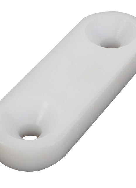 Rectangular white plastic spacer with two countersunk holes at each end. Product Name: AGCO | Block - Acx3144040, Brand Name: AGCO. No current product description information is available.