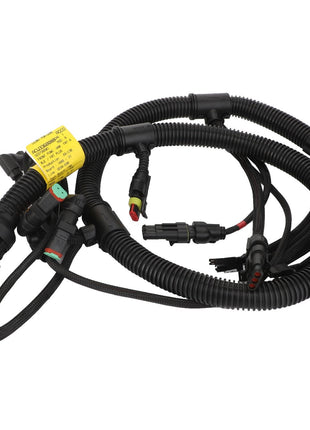 The AGCO | Harness - Acw336008B is a coiled automotive wiring harness featuring various interconnected black cables, plugs, and connectors with a yellow label attached. Please note that no current product description information is available.