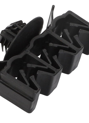 Close-up of the AGCO | Clamp - Acp0670660, a black plastic automotive fastener featuring multiple clips and a push-in pin design. No current product description available.