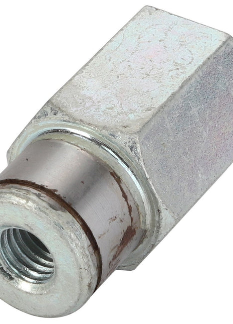 A metallic hexagonal coupling nut with a threaded hole and a worn cylindrical end, lying on a white background. No current product description information is available for the AGCO Pin - La322041250.
