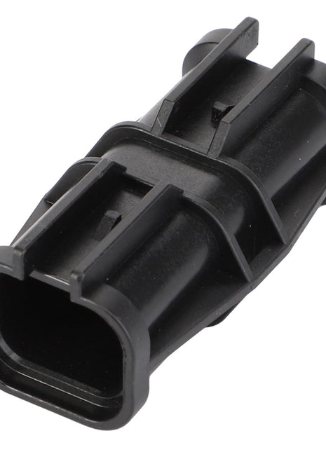 There is no current product description available for the AGCO Adapter - F530200050760, a black plastic electrical connector with a rectangular shape and multiple ridges.