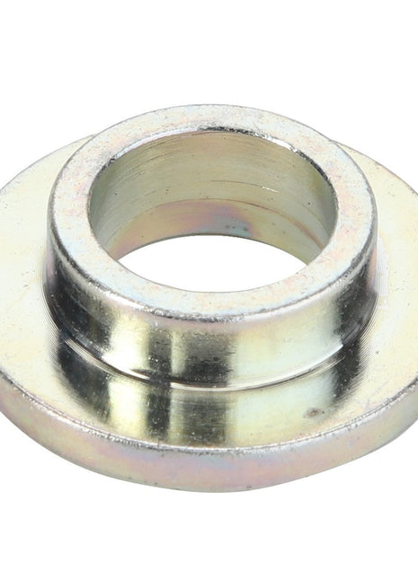 A close-up image of the AGCO BUSH - D28380356, a metallic, hollow cylindrical spacer or bushing with beveled edges.