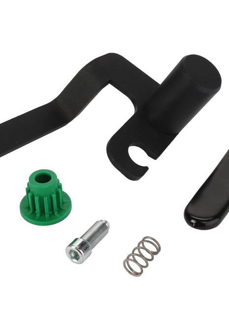 Close-up of several machine components, including a black lever, a green plastic piece, a small metal spring, a screw, and a black cover. Product: AGCO | LOCKING PIN - AL5221476 by AGCO.