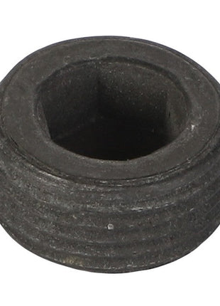 A close-up image of the AGCO | PLUG - 1104151, a round black metal socket head plug featuring exterior threading.
