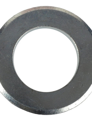 Close-up of the AGCO | WASHER - AL5013128, a metallic washer with a central hole designed for use as a fastening component in mechanical applications.