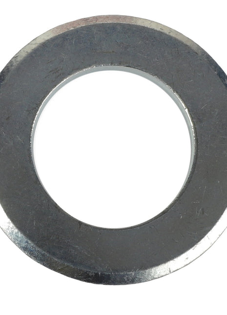 Close-up of the AGCO | WASHER - AL5013128, a metallic washer with a central hole designed for use as a fastening component in mechanical applications.