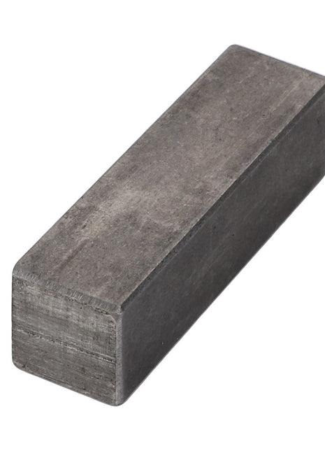 Square metal key by AGCO with a rough surface and sharp edges, viewed at an angle against a white background. No current product description information is available.