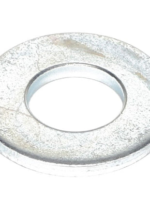 The AGCO | FLAT WASHER - AL5013110 is a metallic washer featuring a circular shape and central hole. The surface appears slightly tarnished. No additional product description information is available at this time.