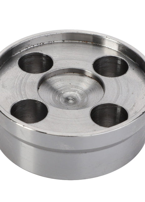 The AGCO Spacer, Front PTO Housing - 4281531M1 is a round metal component with a flat top surface featuring four evenly spaced holes, designed for optimum performance.