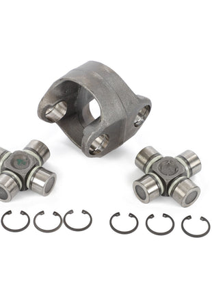 Image showing an AGCO Kit Body - Acp0316260 featuring two cross-and-bearing assemblies, a yoke, and eight retaining clips arranged neatly on a white background. Ideal for AGCO tractor repair kits.